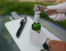 Load image into Gallery viewer, Using a Super Scaler Fish Scaler Bottle Opener 1